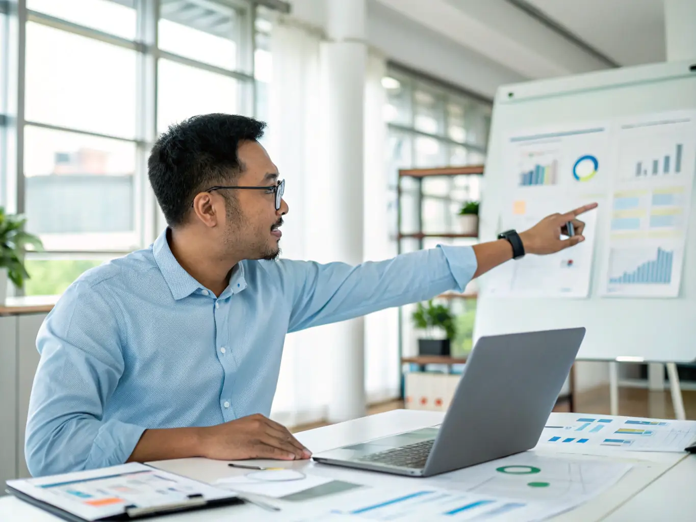 A professional IT consultant is configuring cloud settings on a laptop, with a server room visible in the blurred background, symbolizing the flexibility of cloud solutions.